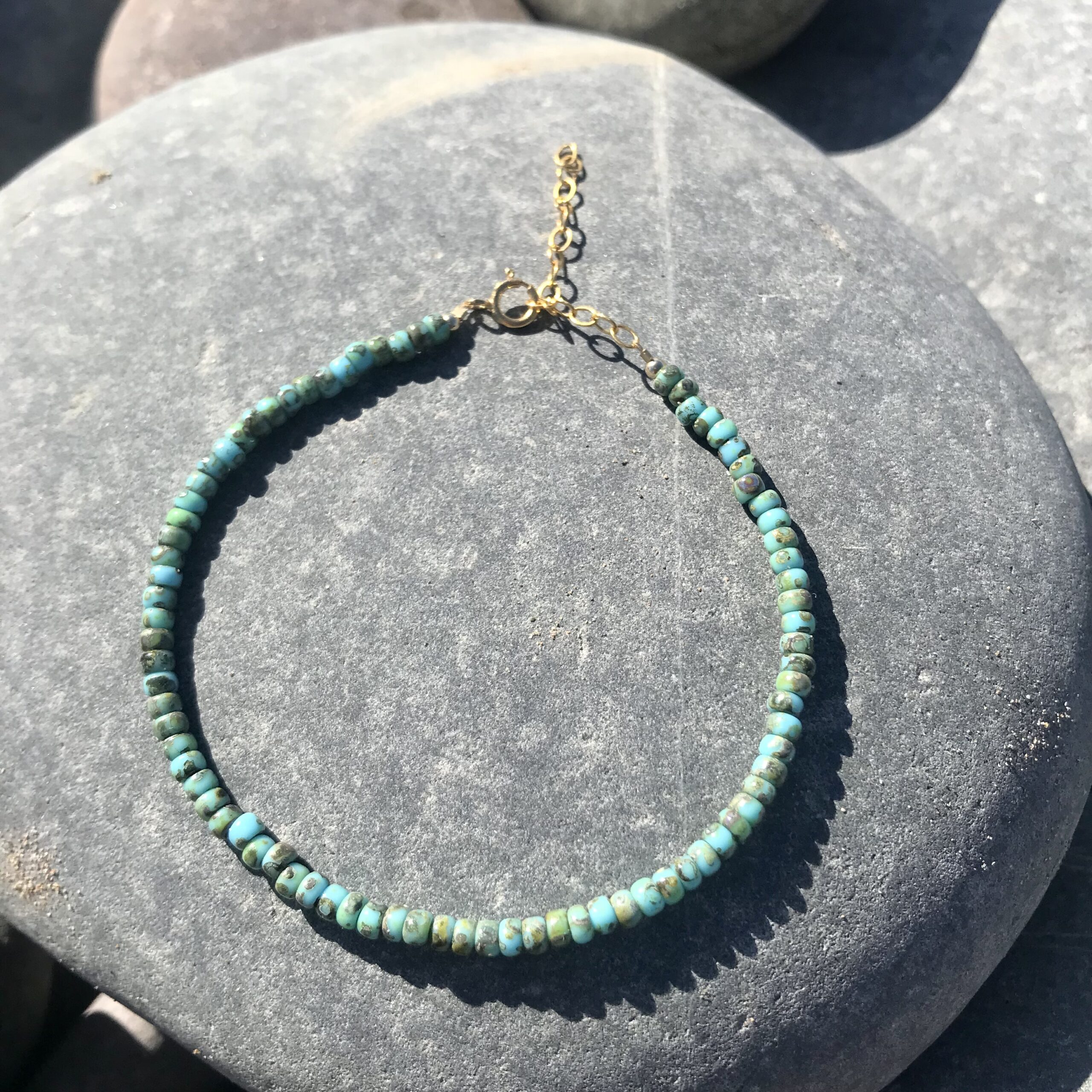 The Seafoam Drift Miyuki Beaded Bracelet with gold filled clasp and extender chain.