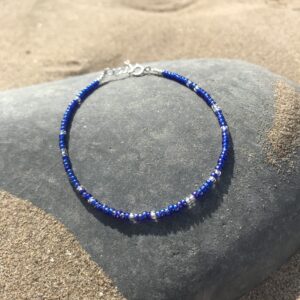 Cobalt Drift Beaded Bracelet on the beach.