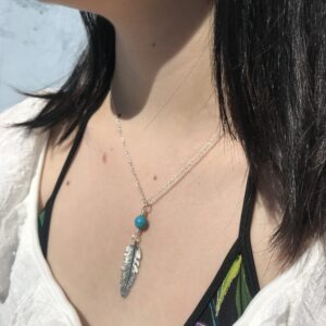 Turquoise and feather boho necklace.