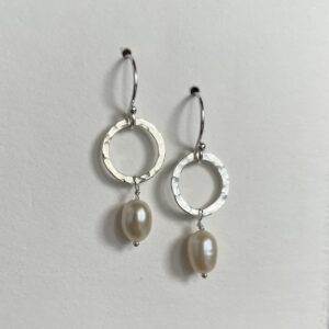 Hammered sterling silver and pearl drop earrings.