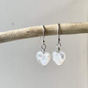 Dainty Mother of Pearl Heart Earrings in sterling silver.
