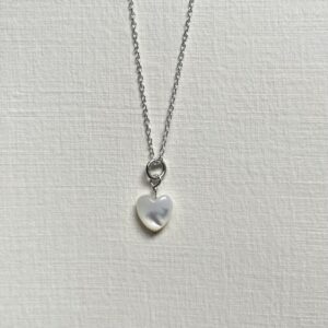 Dainty mother of pearl heart necklace in sterling silver.